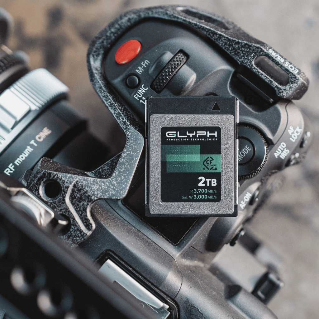 Glyph 2TB memory card next to a camera