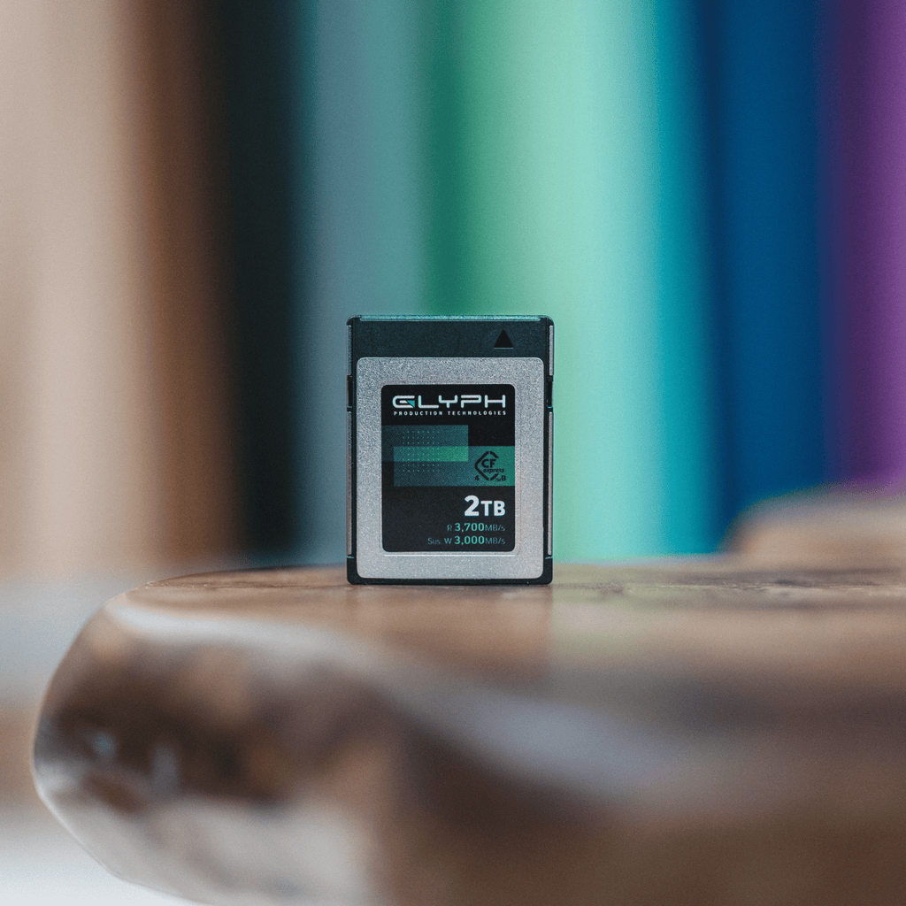 Glyph 2TB CFexpress memory card on wooden surface